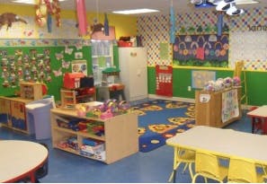 Preschool classroom with colorful decorations and small tables