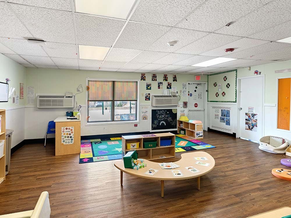 Classroom with a colorful rug and low tables