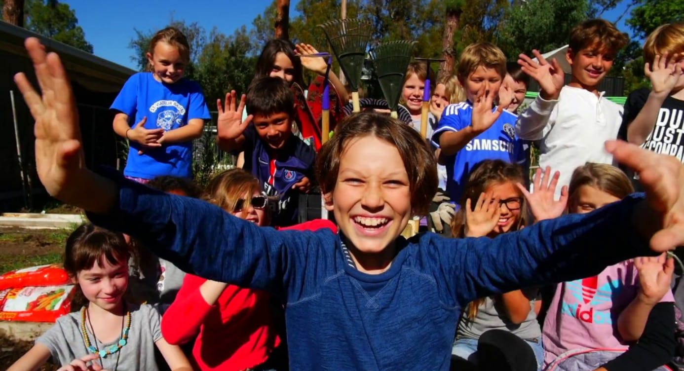 Group of children waving