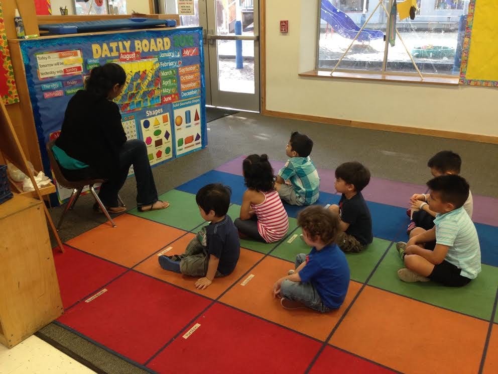 Person teaching children in a classroom