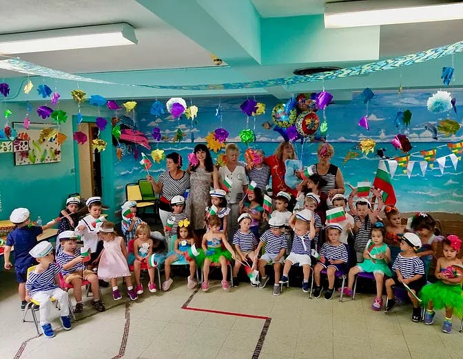 Group of adults and children in a decorated room