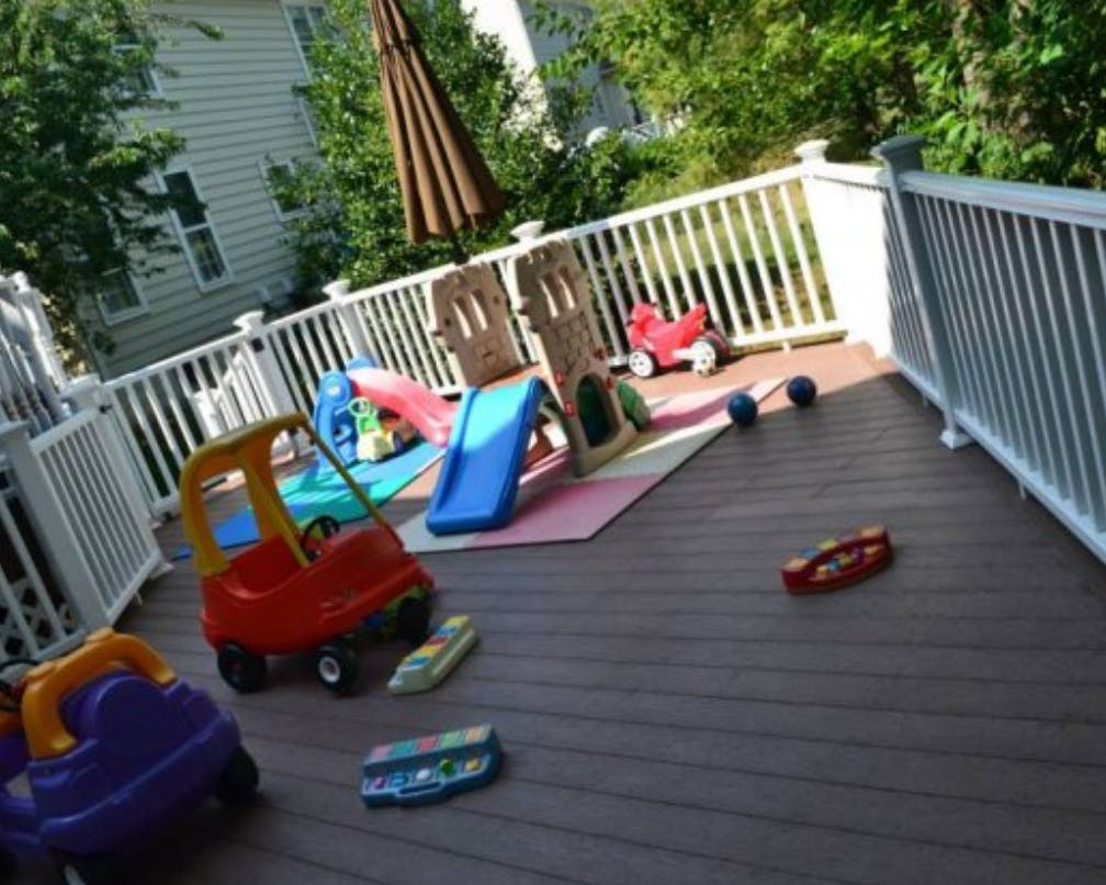 Children's toys and play equipment on a deck