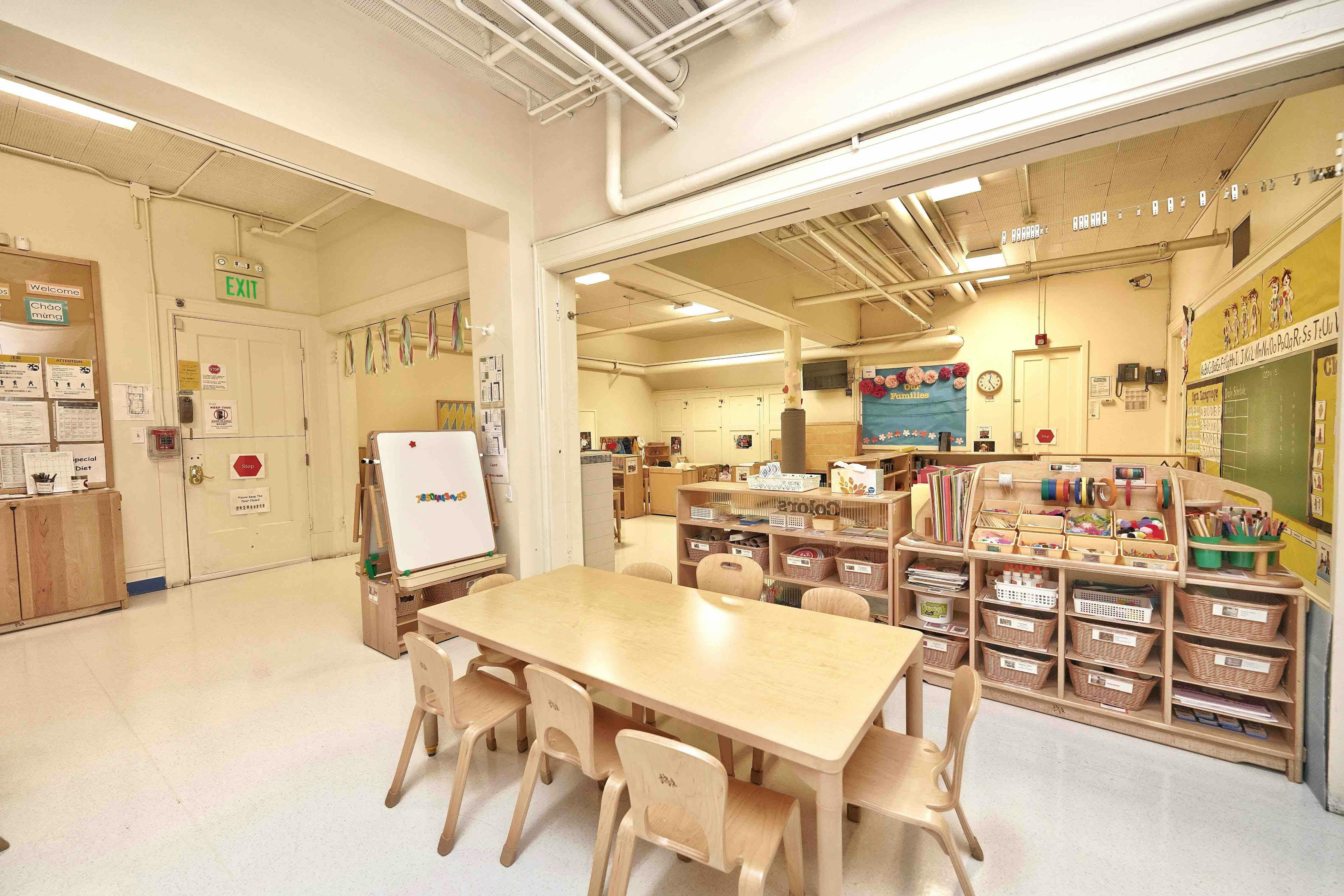 Wooden table and chairs in an open child care classroom