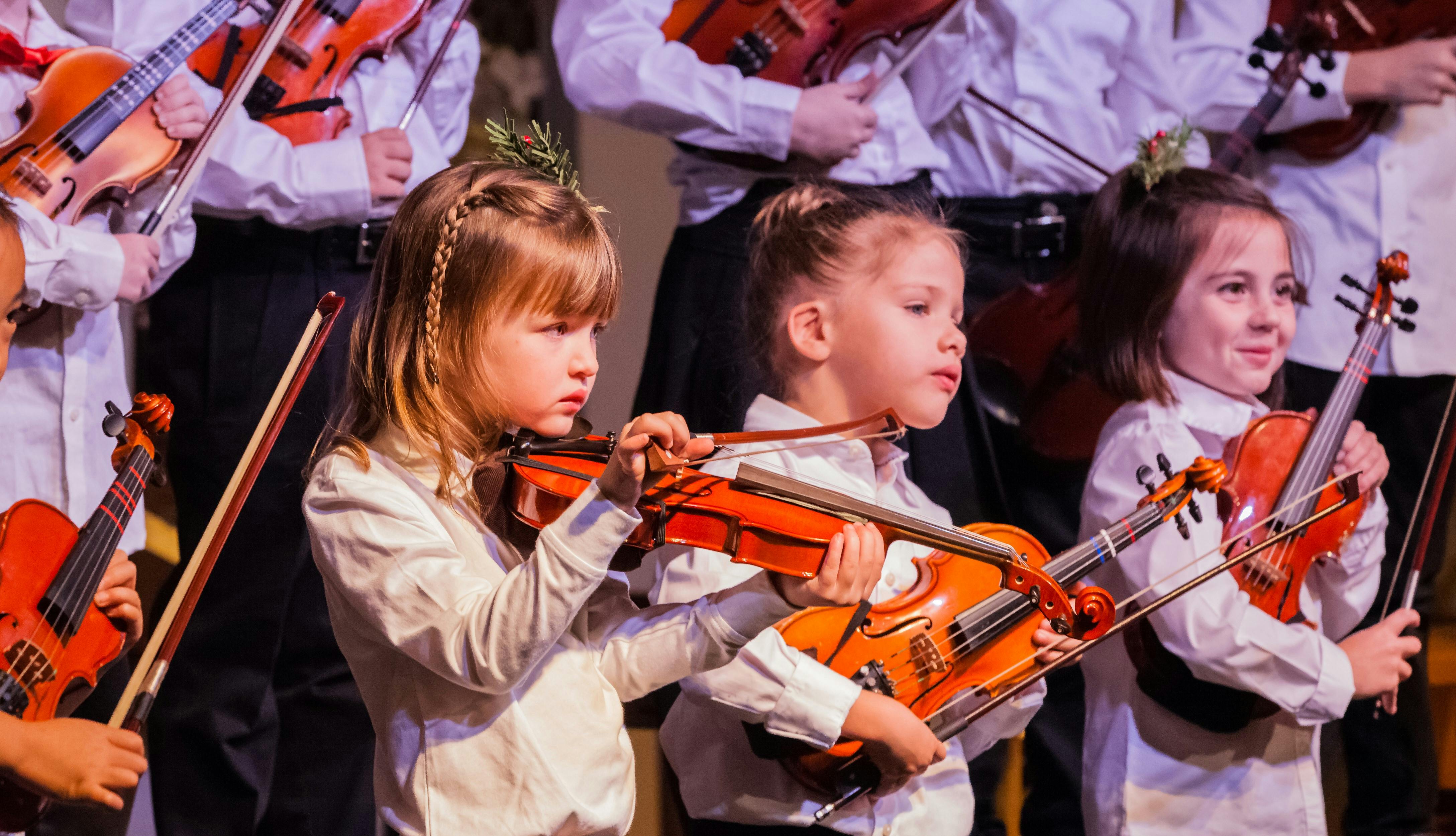 Children playing violins