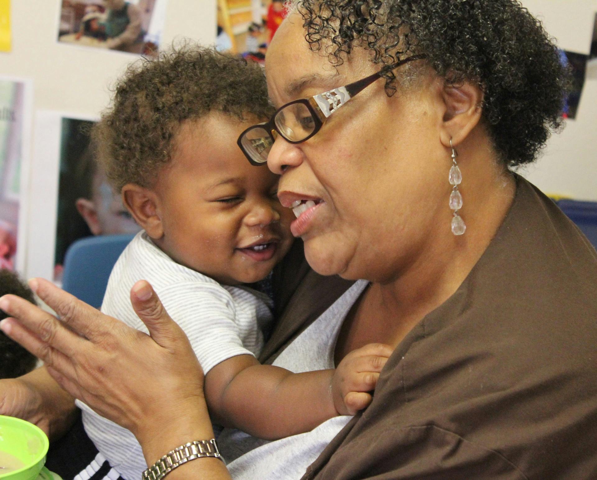 Adult holding a child