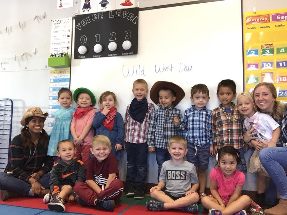 Adults and children in a classroom