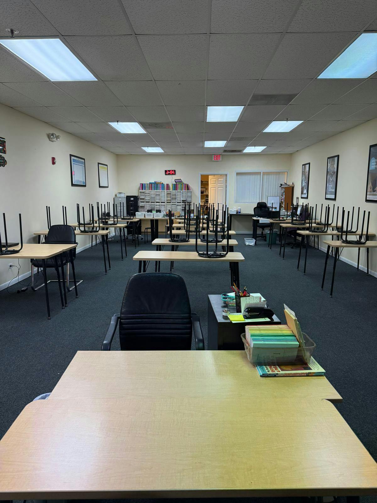 Classroom with chairs stacked on top of desks
