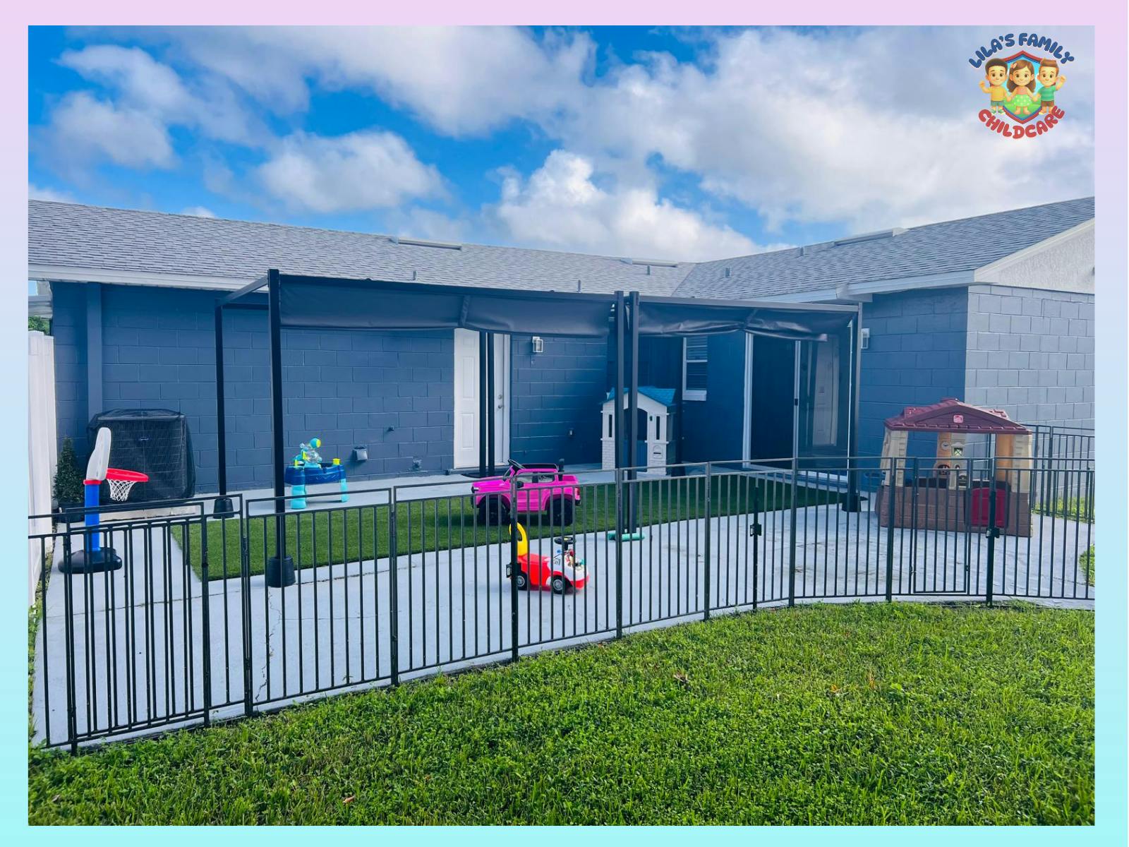 Playground area with small toys and playhouses behind a fence