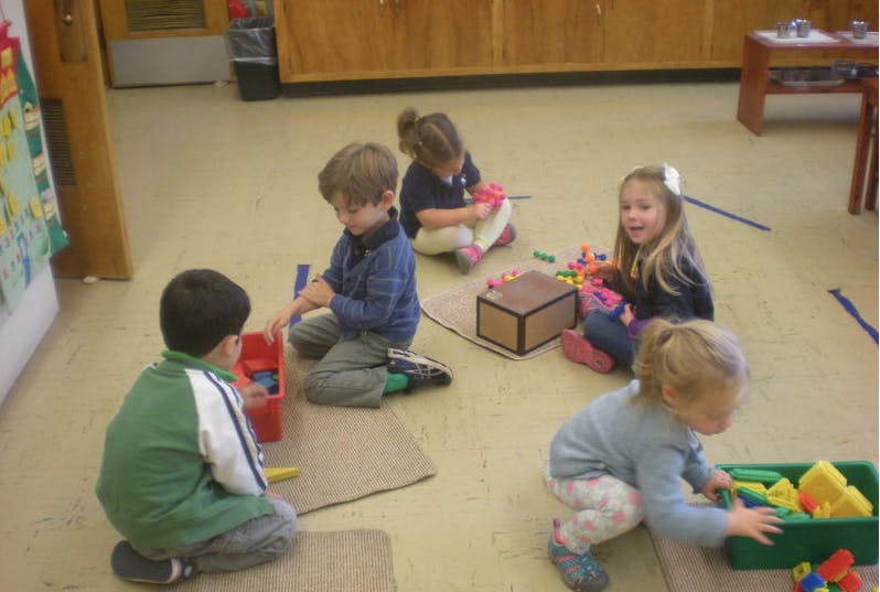 Children playing with toys on the floor