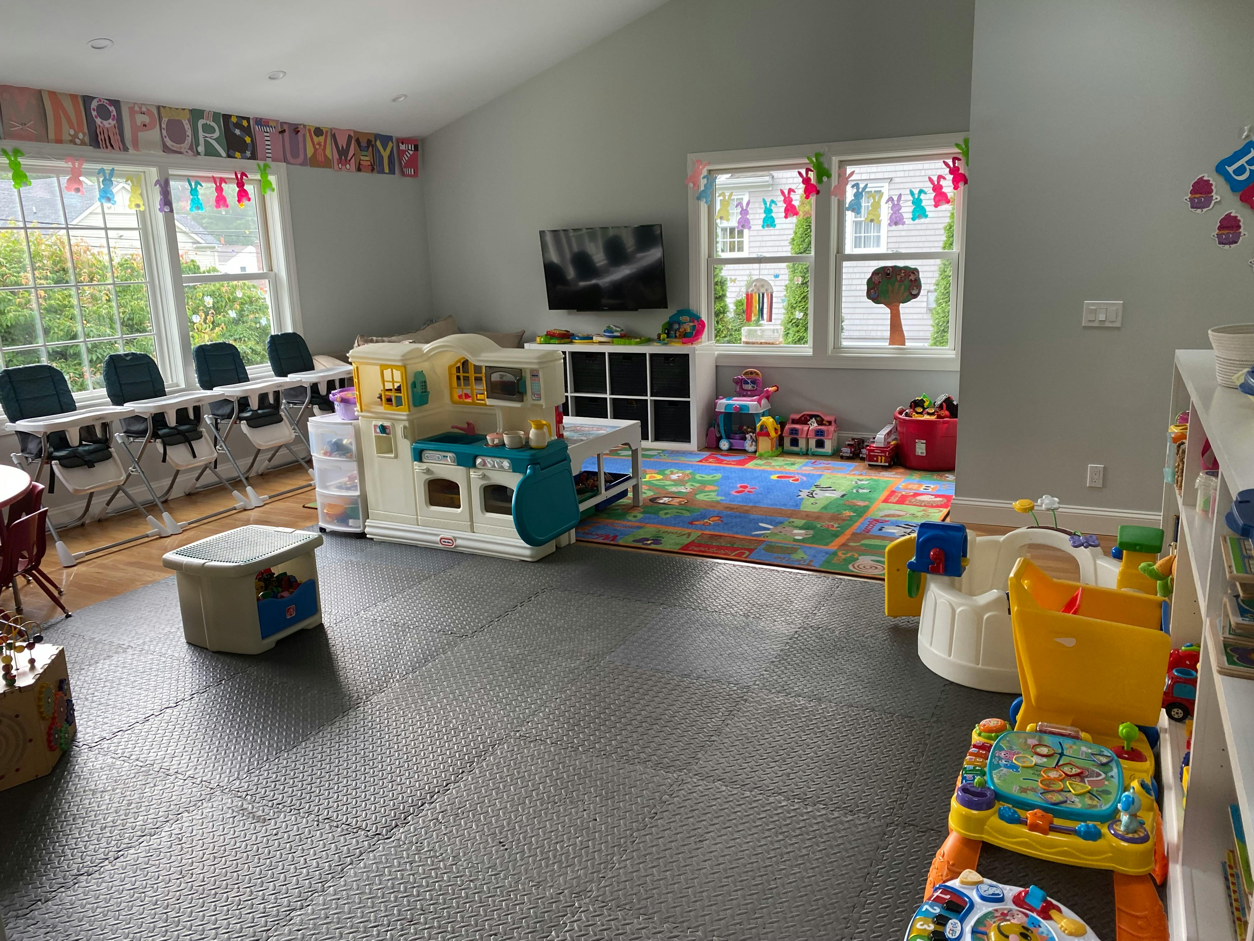 Playroom with children's toys, tables, and chairs