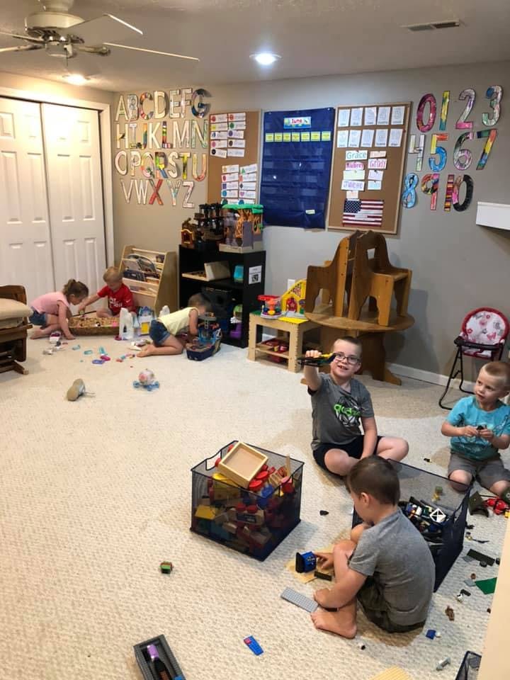 Children playing with toys on a carpeted floor
