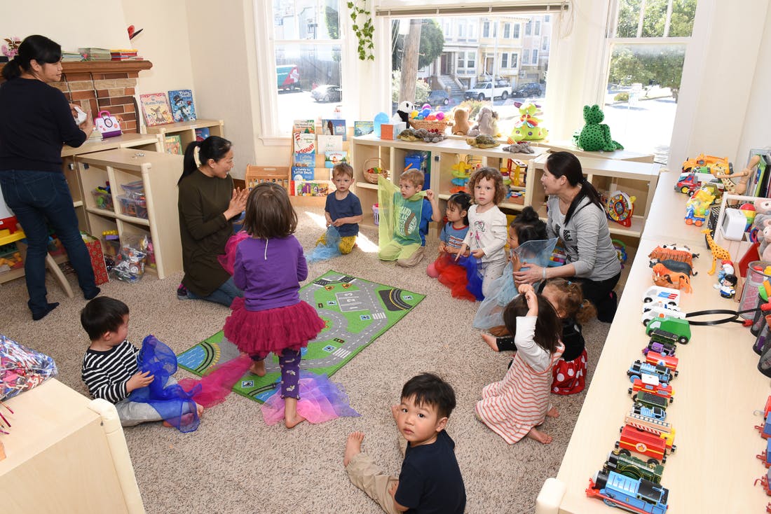 Adults and children in a classroom