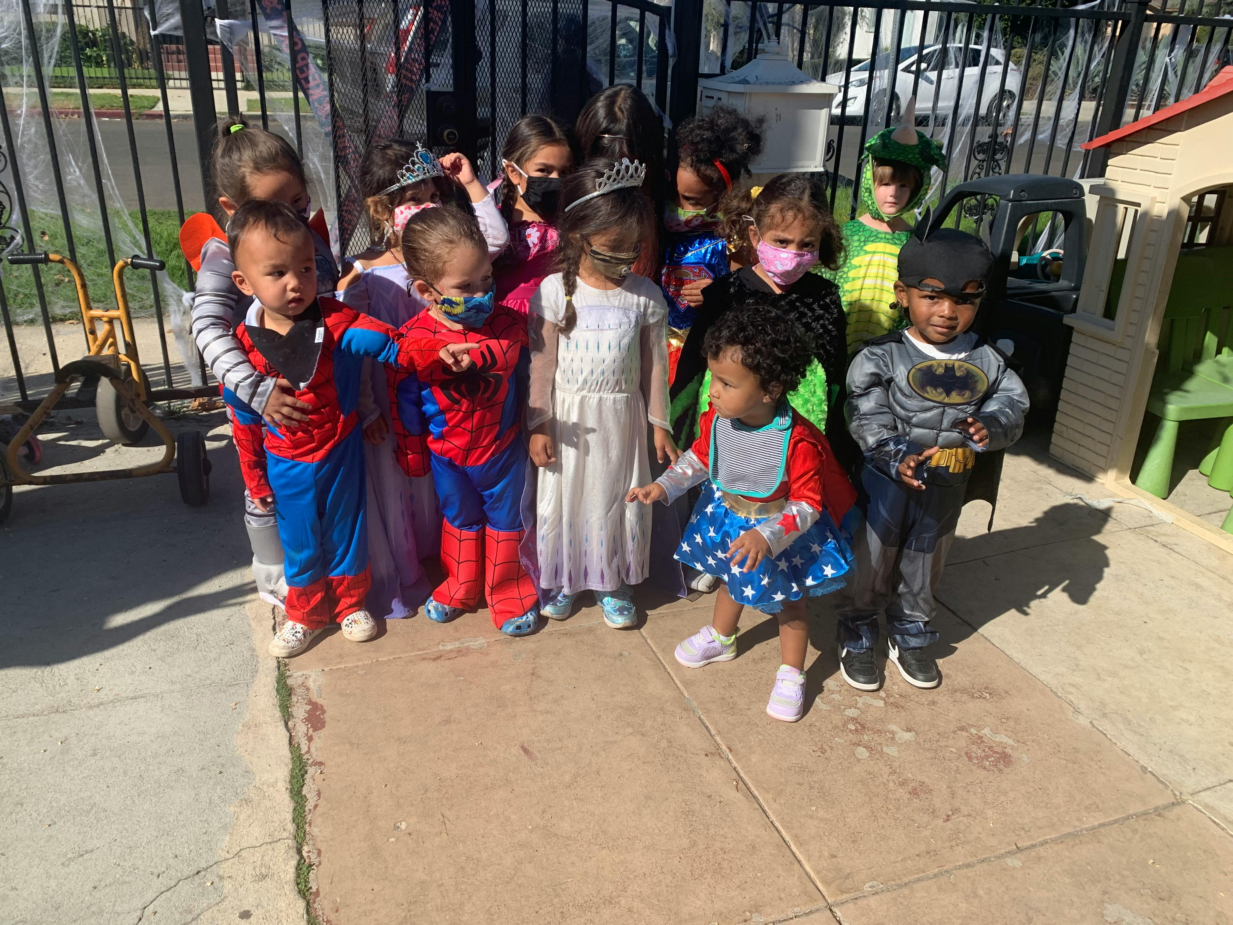 Group of children in costumes standing outdoors