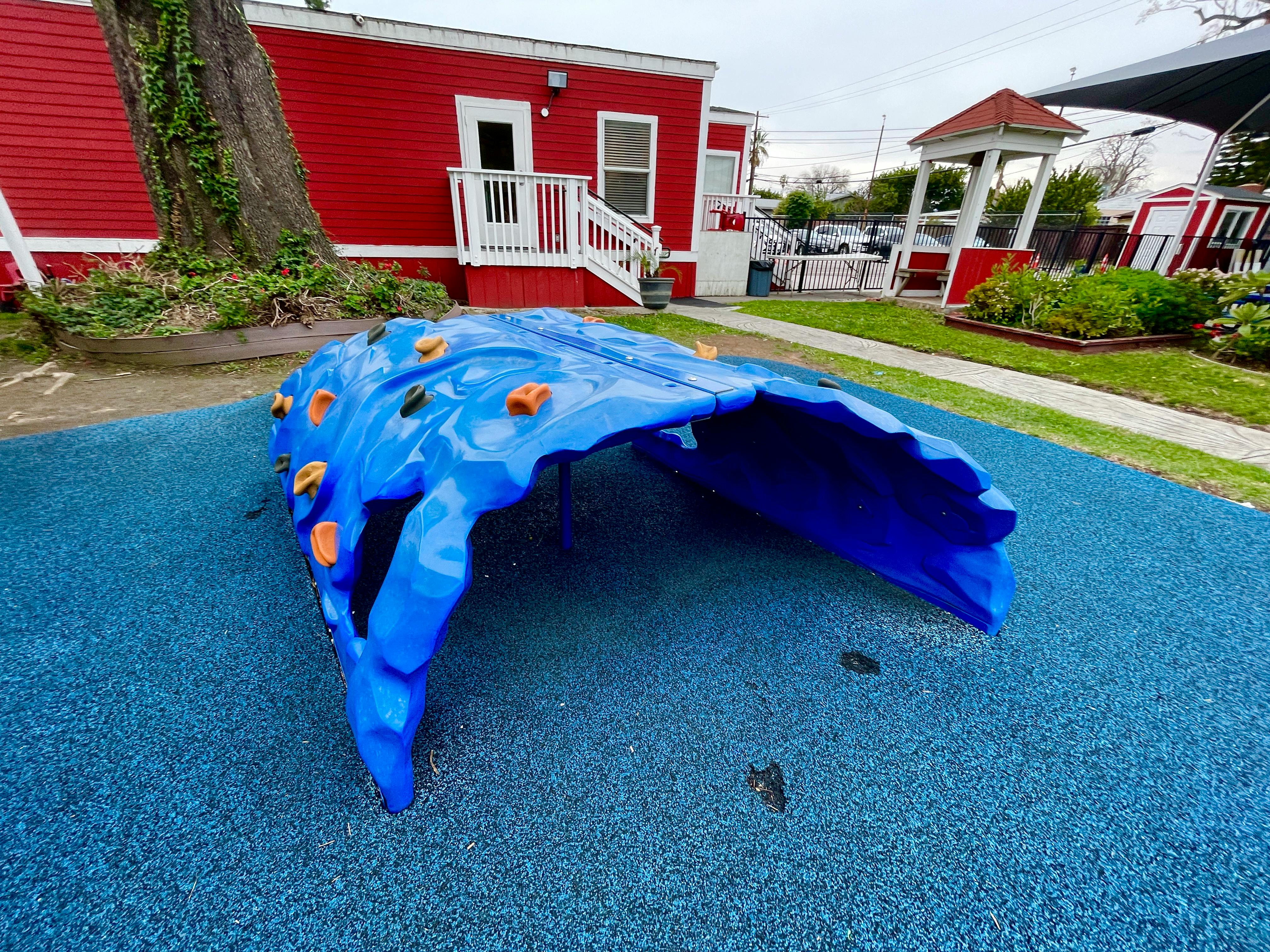 Blue climbing tunnel on a playground