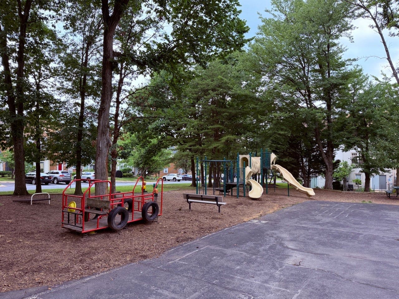 Playground equipment including a slide and a ride-on structure