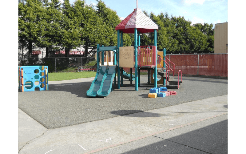 A colorful playground with slides and climbing structures