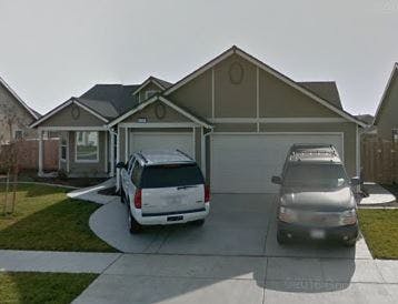 House with two cars parked in the driveway