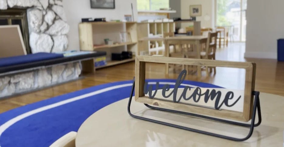 Decorative welcome sign on a table in a classroom