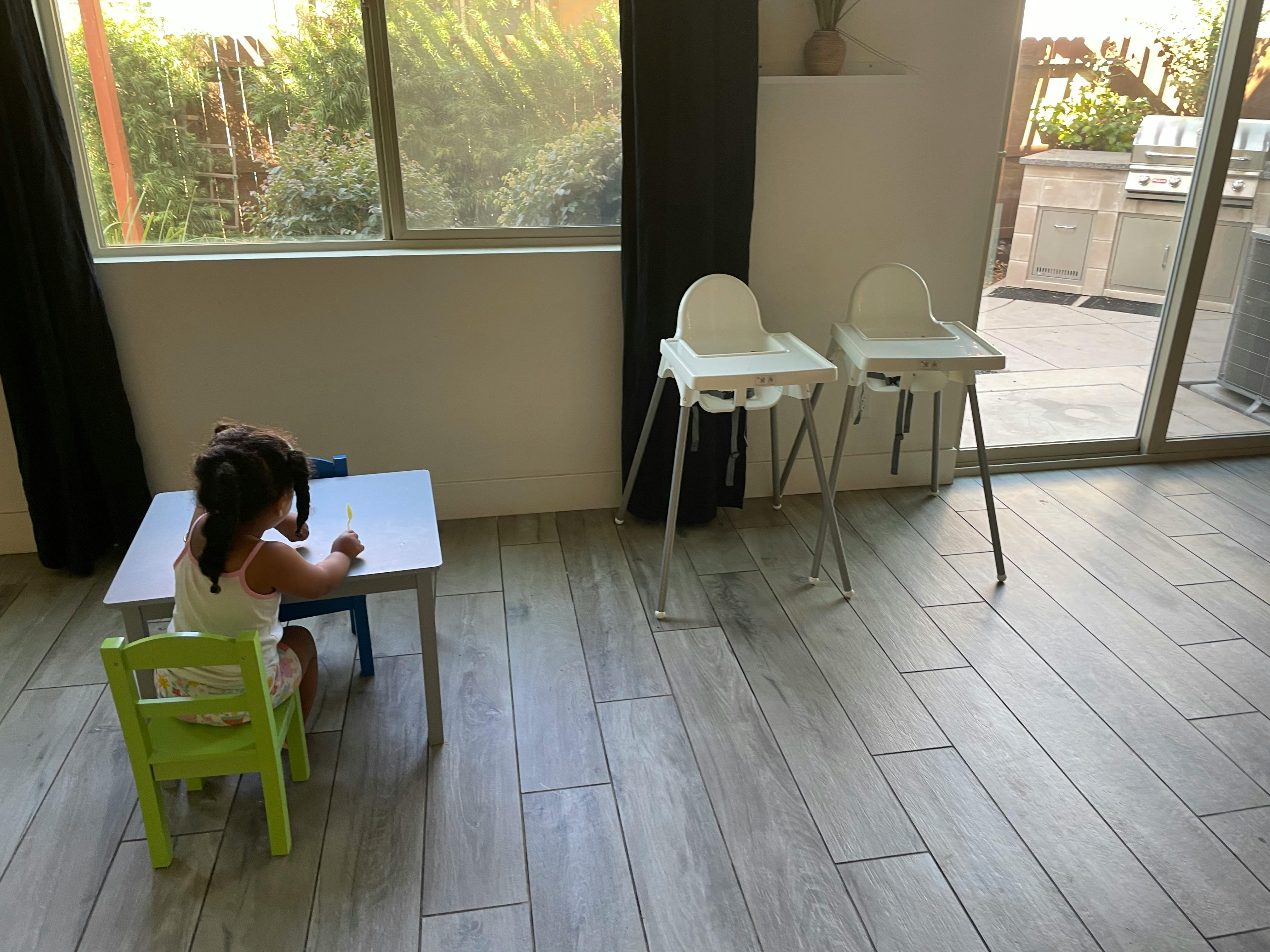 Child sitting at a small table