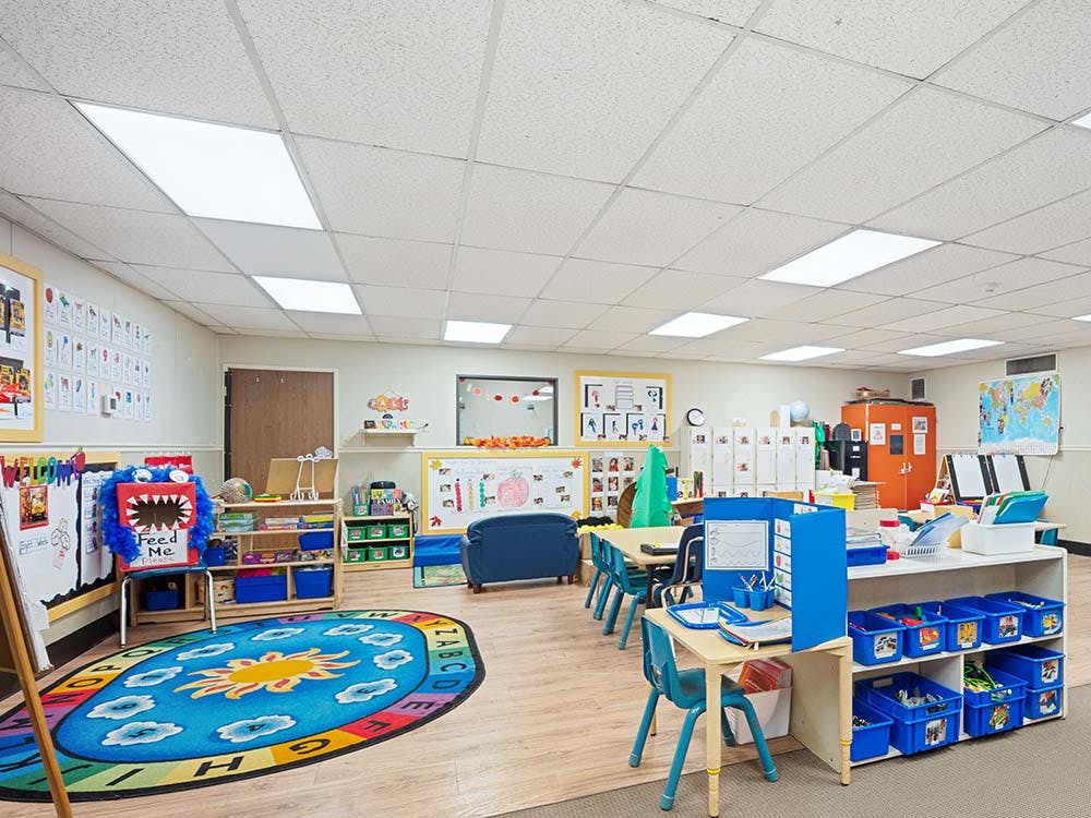 Classroom with child-sized furniture and colorful teaching aids
