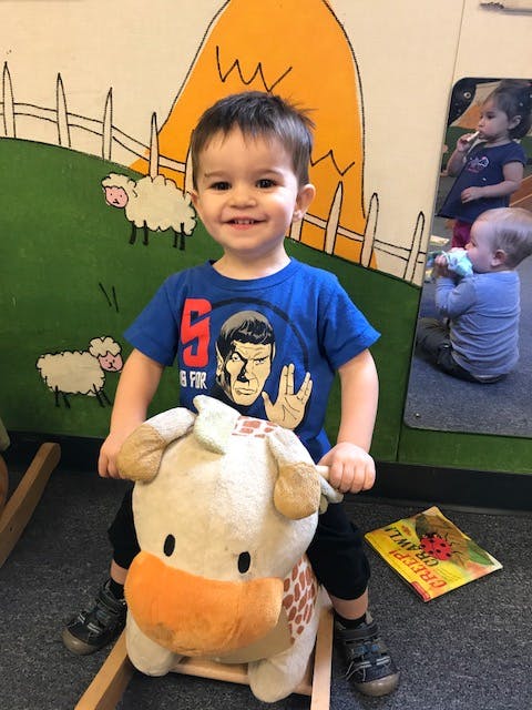 Child on a rocking toy