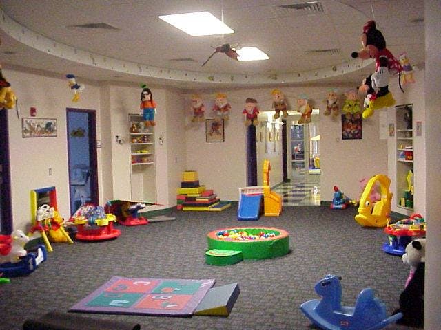 Indoor playroom with various toys and play equipment