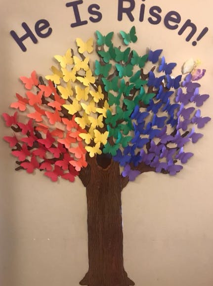 Tree with rainbow butterflies for leaves and "He Is Risen!" text