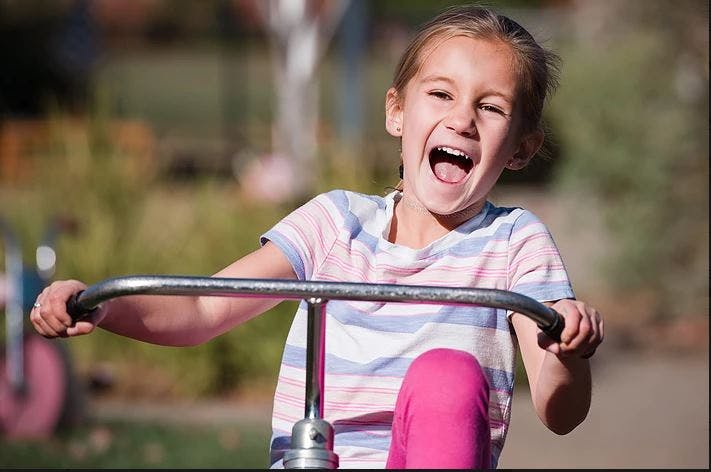 Child riding a tricycle
