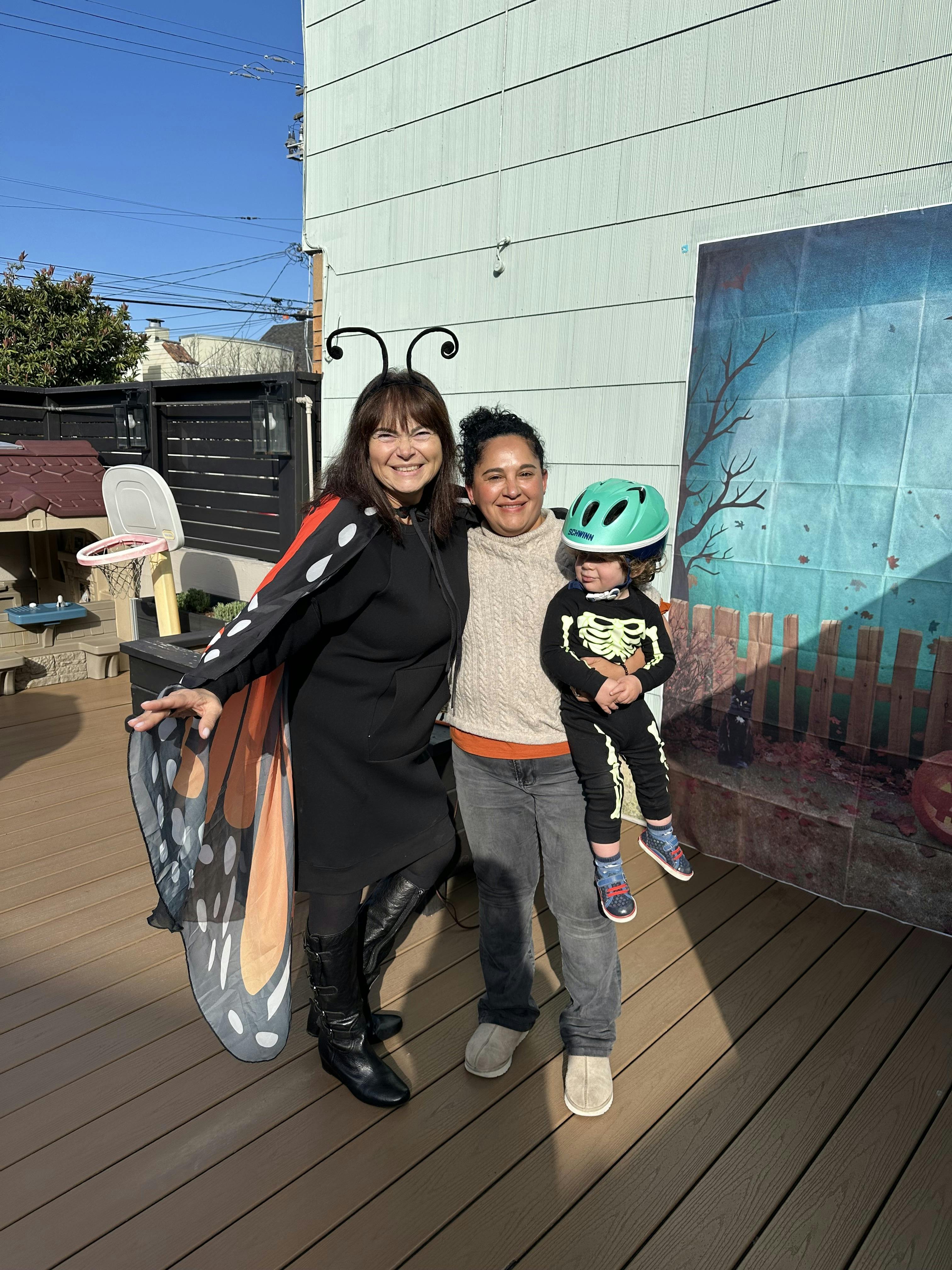 People in costumes standing on a deck