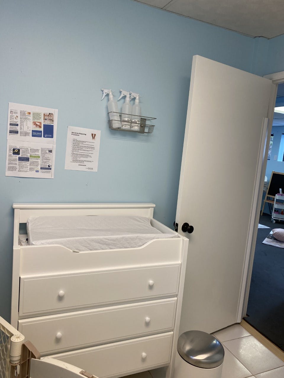 Changing table with a changing pad in a room