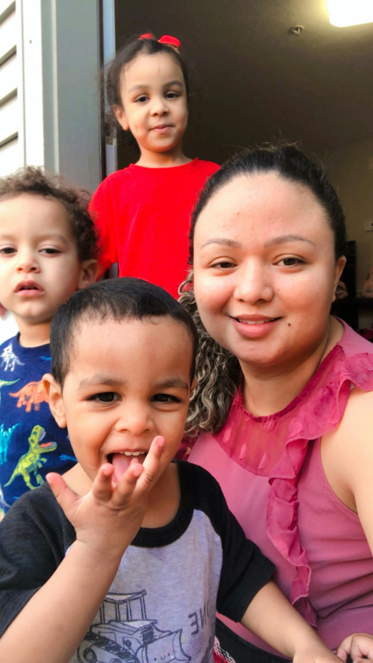 Person with three children