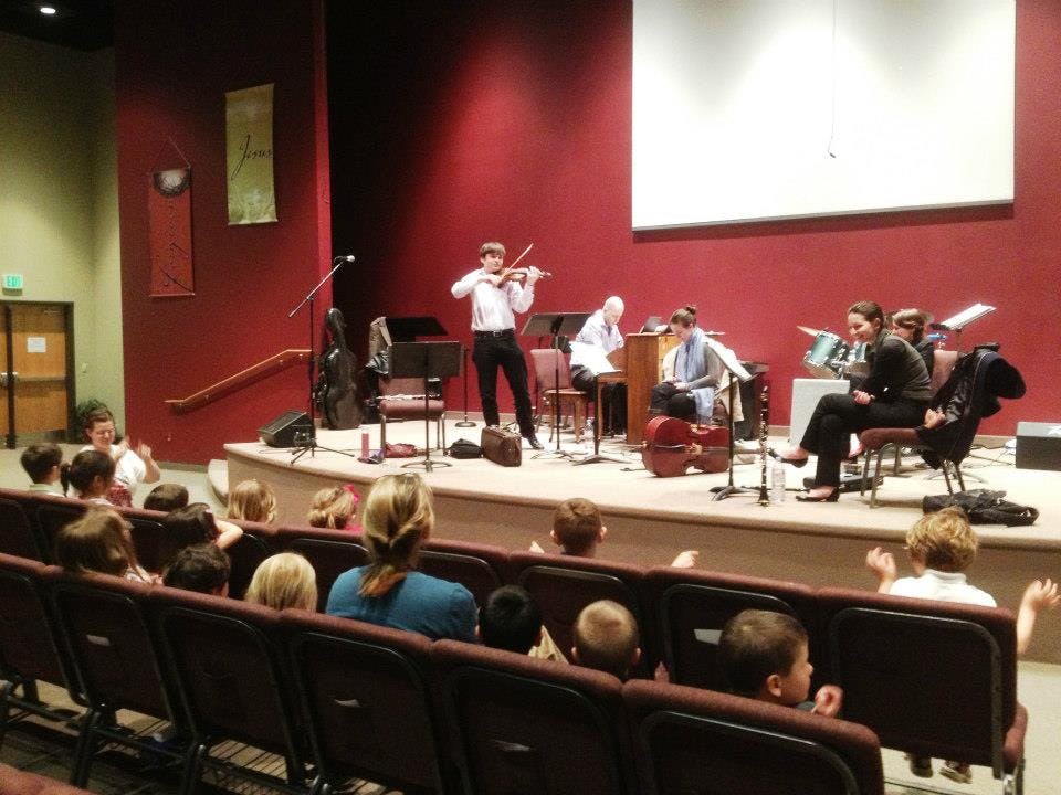 People watching a musical performance on a stage