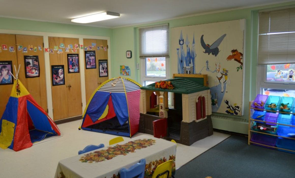 Playroom with colorful tents and playhouses