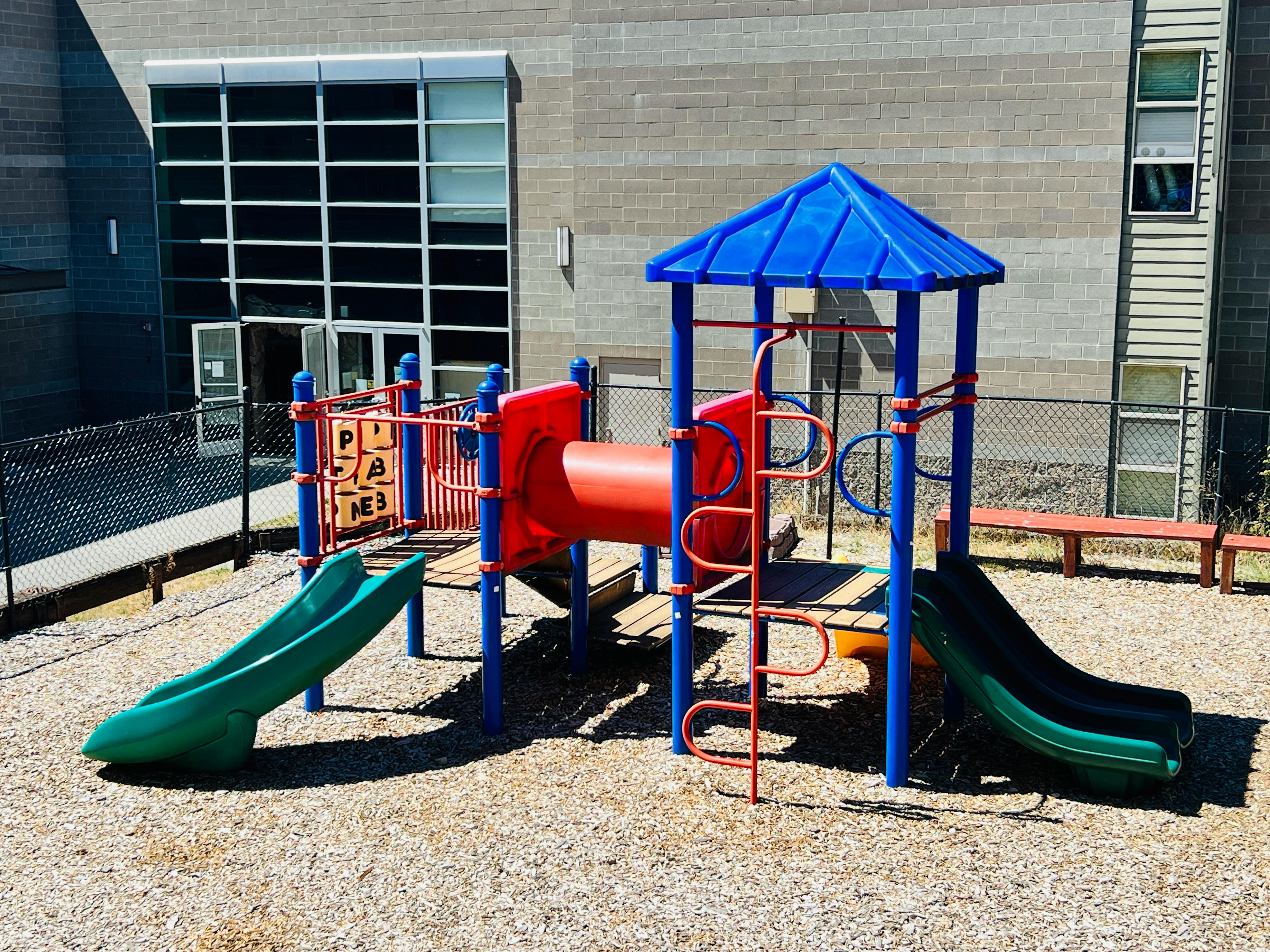 Playground with slides and climbing structures