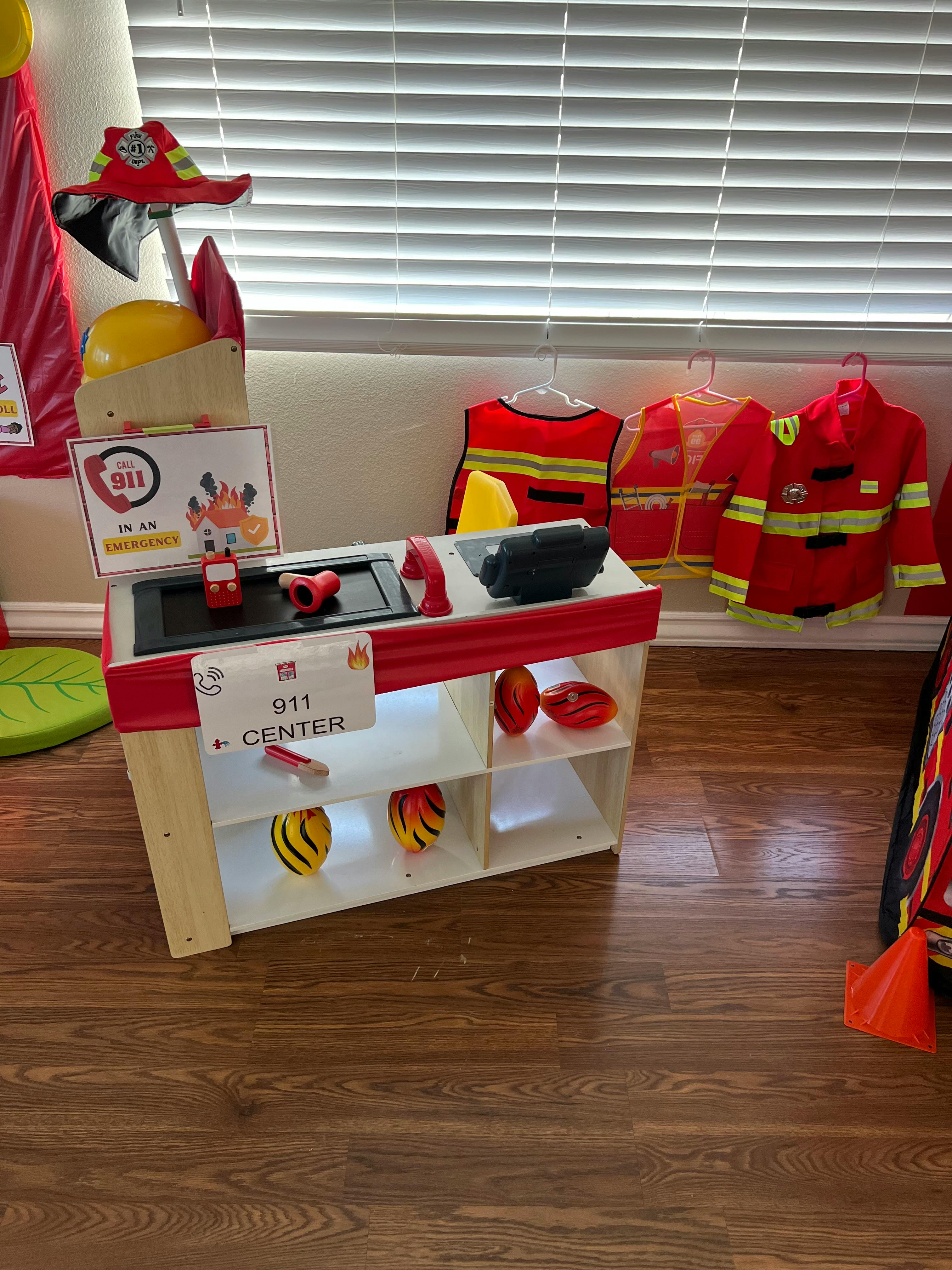 Firefighter play station with costumes and accessories
