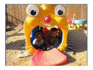Two children in a yellow play structure