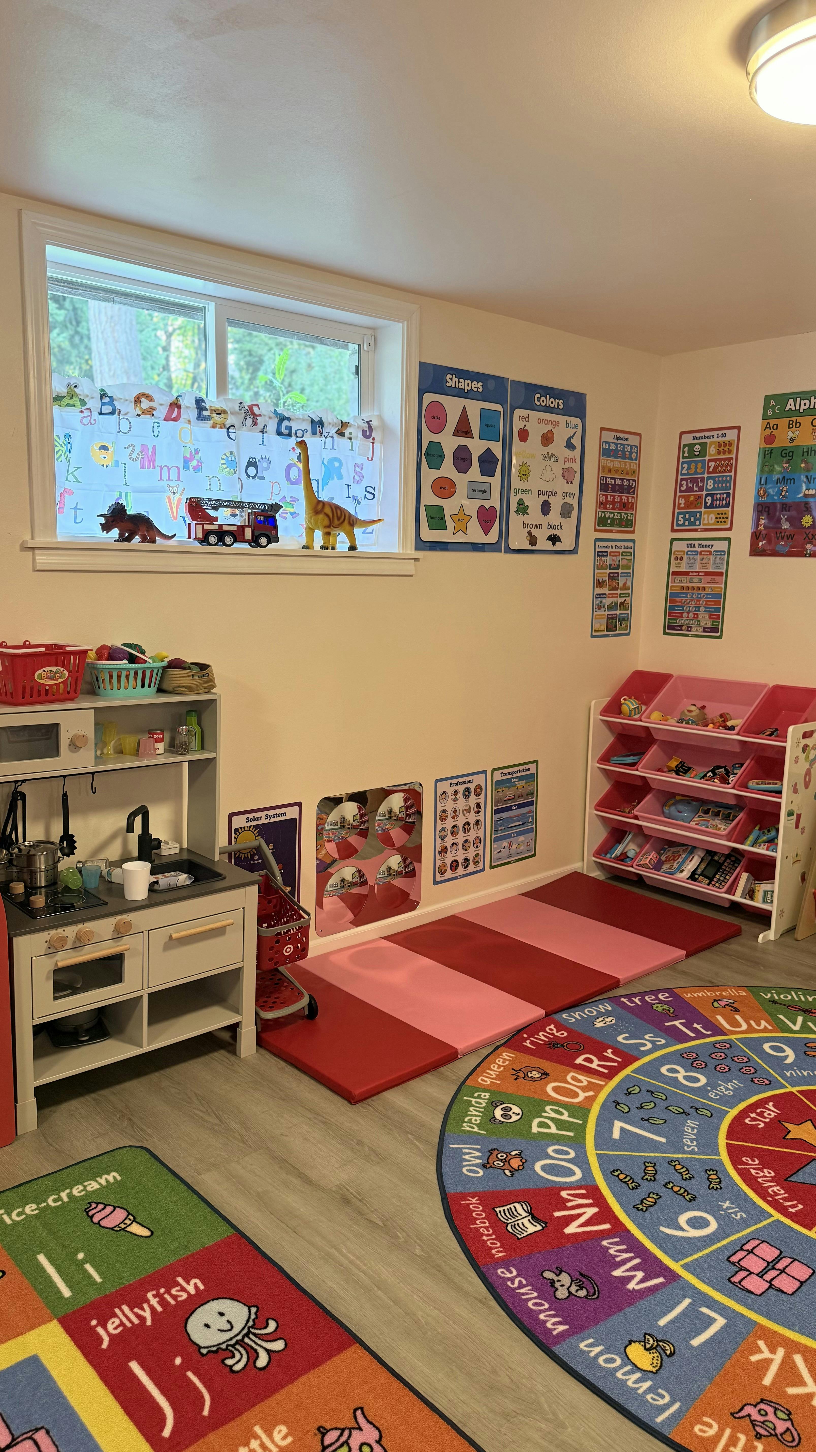 Playroom with educational floor mats and wall posters