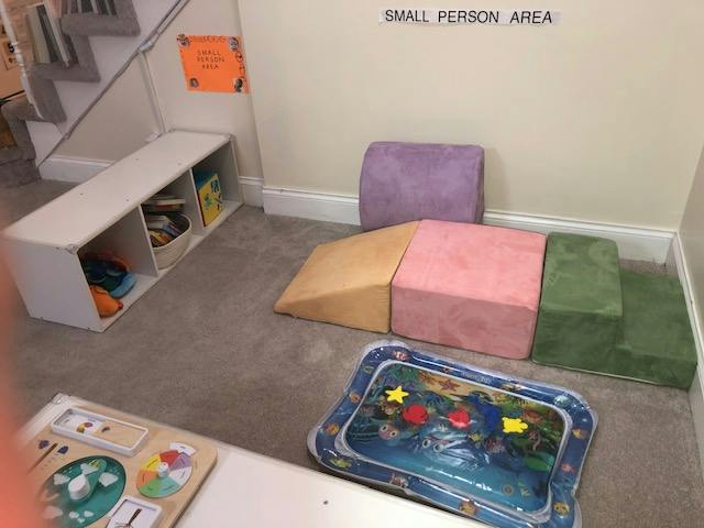 Soft play foam climbing blocks and activity mat in a child play area