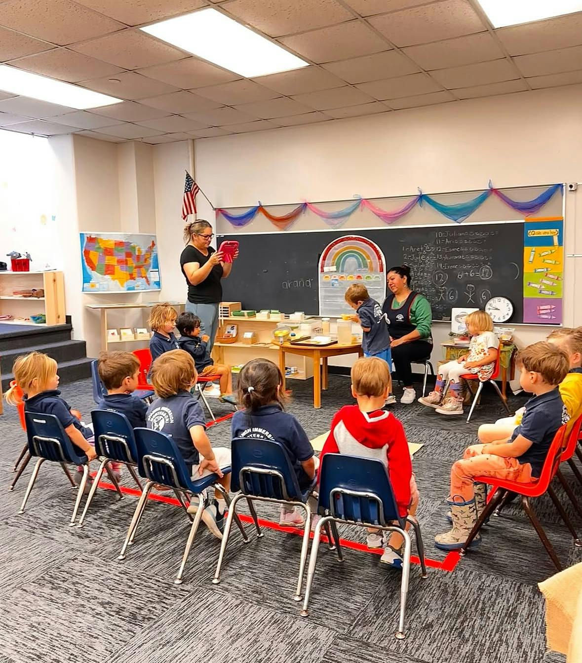 Adults teaching children in a classroom
