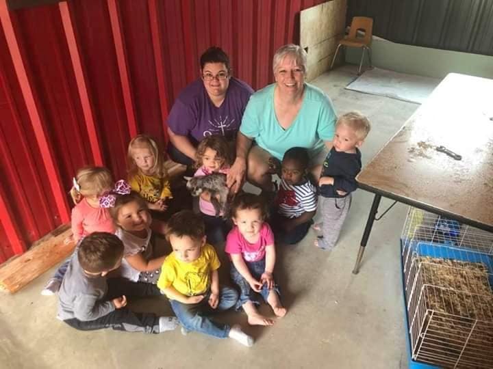 Two adults and multiple children posing for a photo