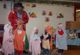 Adult and children in costumes