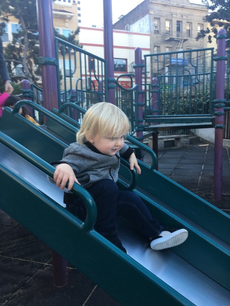 Child on a playground slide