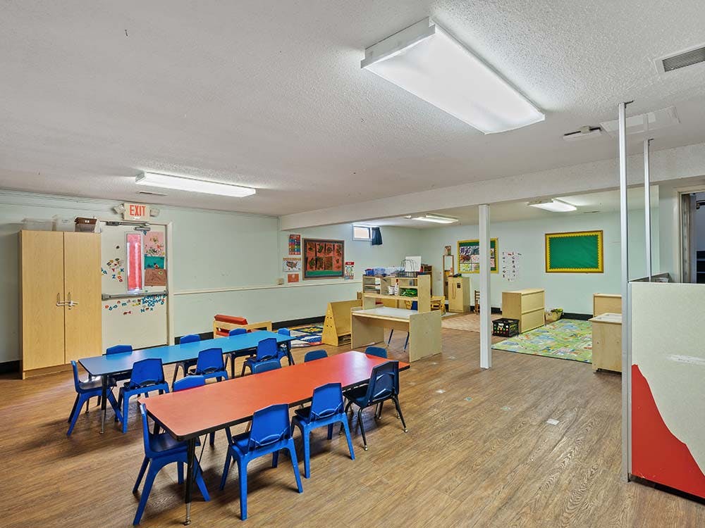 Classroom with child-sized tables and chairs