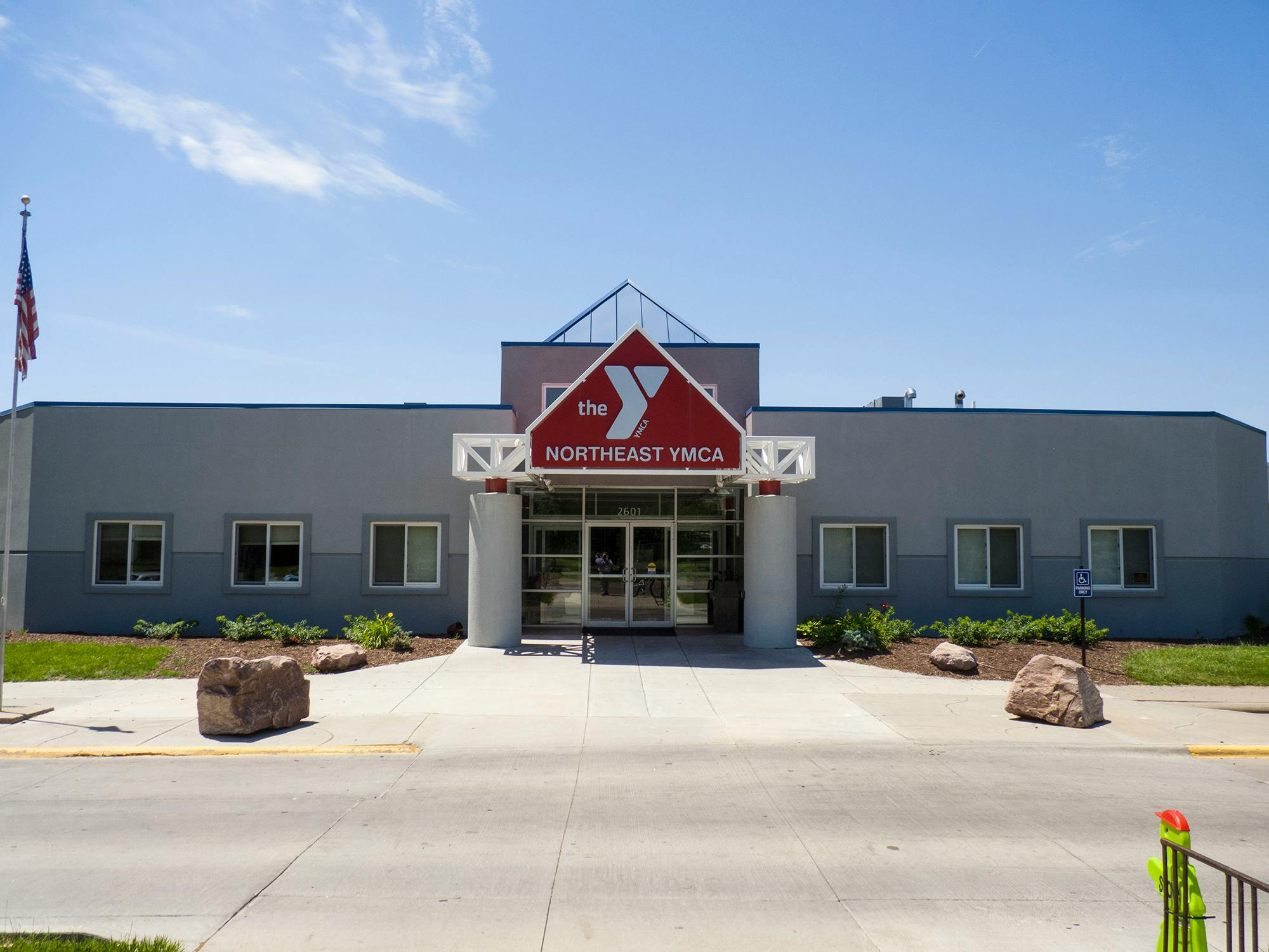 The Northeast YMCA building entrance with a red sign
