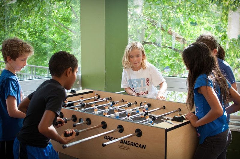Children playing foosball