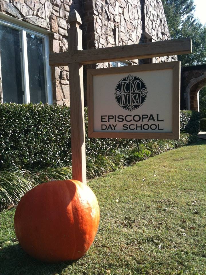 Episcopal Day School sign with a large pumpkin at its base