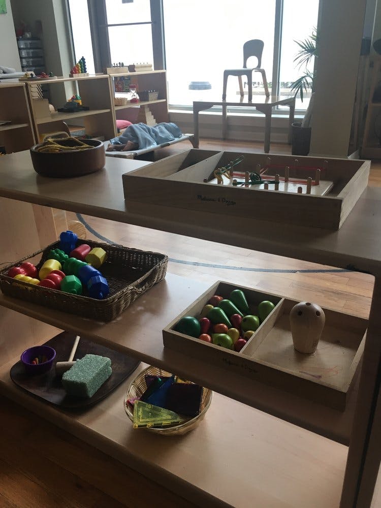 Shelves with various toys and learning materials in a classroom