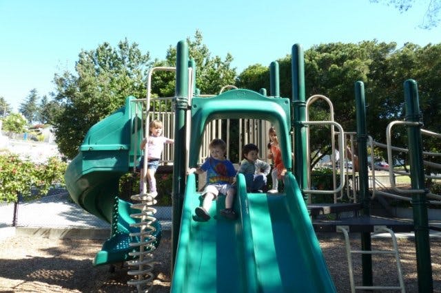 Children on a playground slide