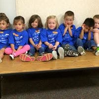 Group of children sitting on a bench