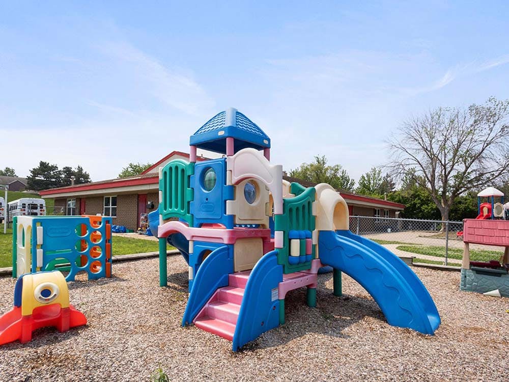Colorful outdoor playground equipment with slides and climbing structures